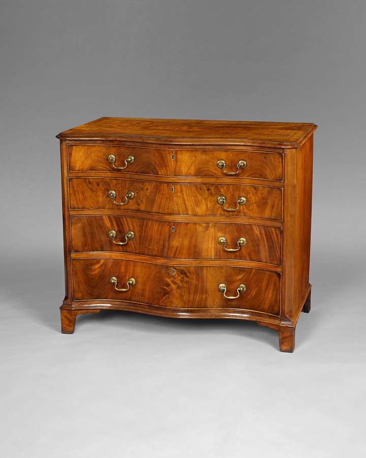 A George III period mahogany serpentine chest